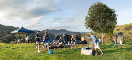 family playing games during camping 